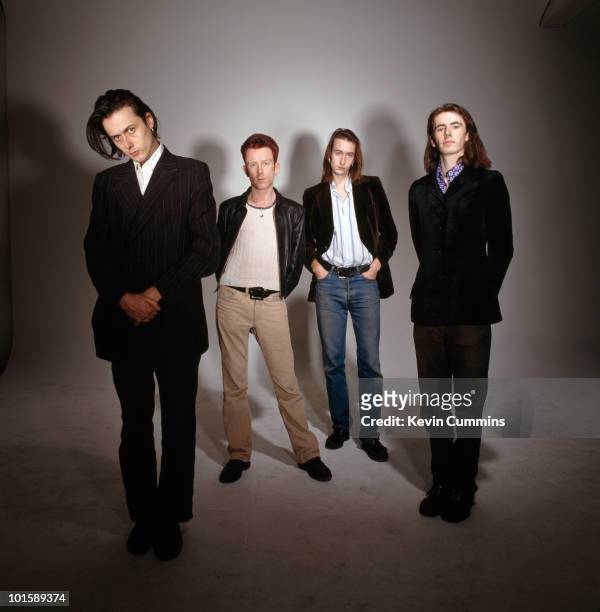 Posed group portrait of British band Suede. Left to right are singer Brett Anderson, drummer Simon Gilbert, bassist Mat Osman and guitarist Bernard...