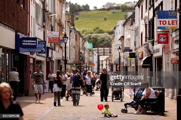 Members of the public walk through Whitehaven town centre on June 3, 2010 in Whitehaven, England. 12 people were shot dead yesterday and a further 25...