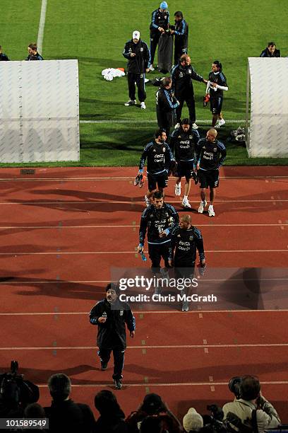 Argentina's head coach Diego Maradona leads his team from the field after a team training session on June 3, 2010 in Pretoria, South Africa.
