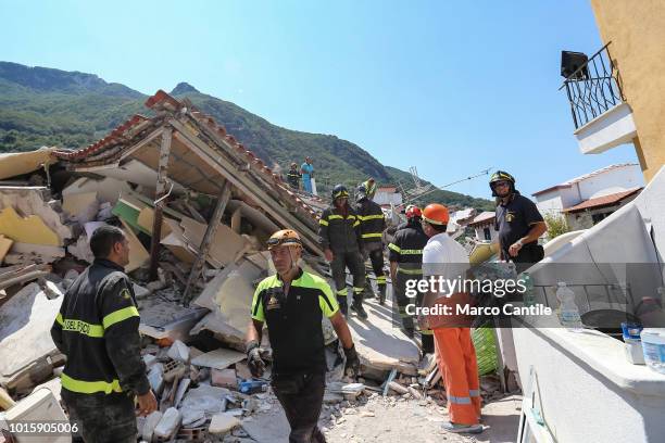 Rescue men, and firemen, on the rubble of a house completely collapsed after the earthquake that hit the city of Casamicciola, in Ischia.