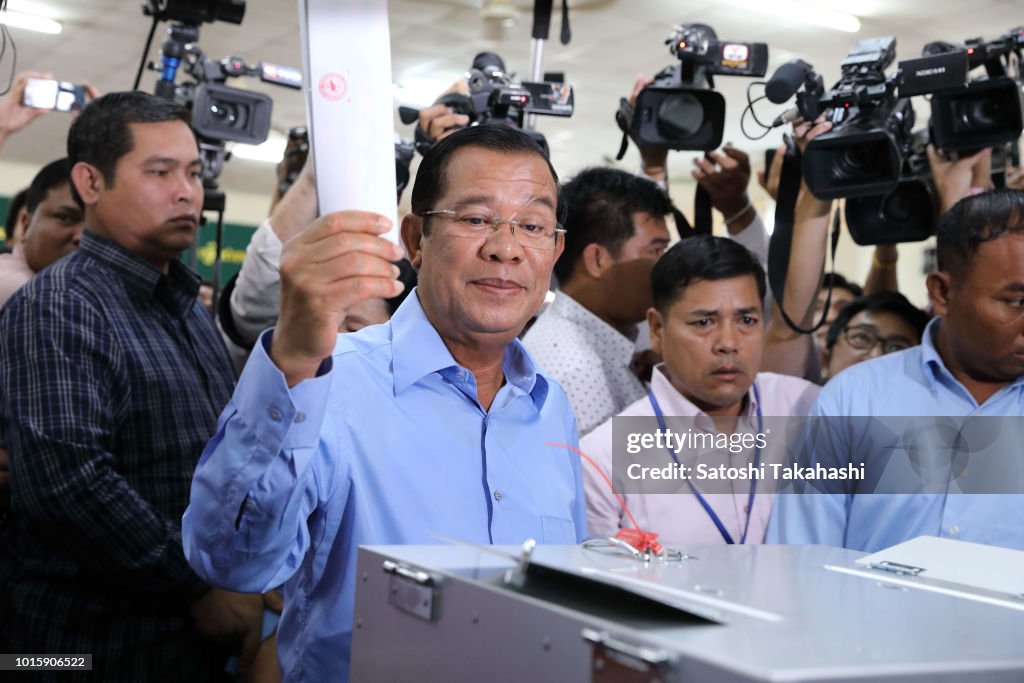 Hun San Cambodian Prime Minister Hun Sen raises his ballot at a polling... News ...
