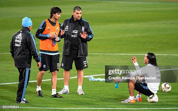 Carlos Tevez of Argentina national football team talks with teammate Javier Pastore after training session on June 3, 2010 in Pretoria, South Africa....