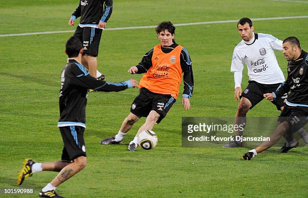 Lionel Messi of Argentina national footbal team passes the ball during training session on June 3, 2010 in Pretoria, South Africa. Argentina opens...