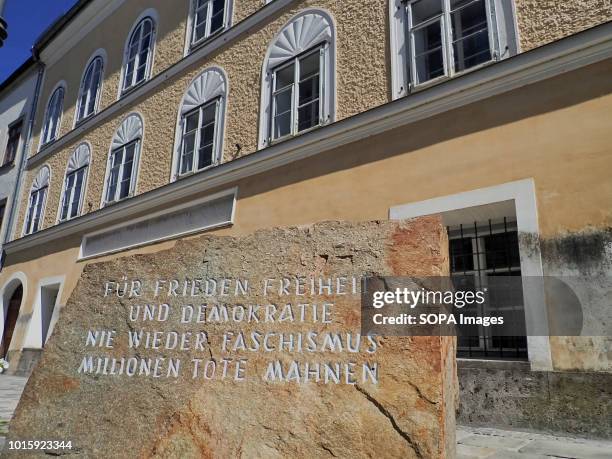 In front of Hitlers birthplace there is a stone from a stone-quarry in Mauthausen concentration camp where prisoners had to work. "For peace, freedom...