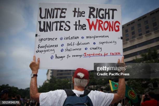 Protesters attend the Unite Against Hate rally in Freedom Plaza along Pennsylvania Avenue, ahead of a planned white supremacist event near the White...