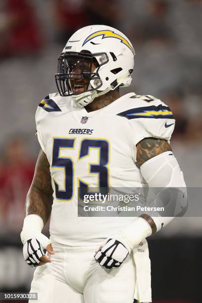 Center Mike Pouncey of the Los Angeles Chargers warms up before the preseason NFL game against the Arizona Cardinals at University of Phoenix Stadium...