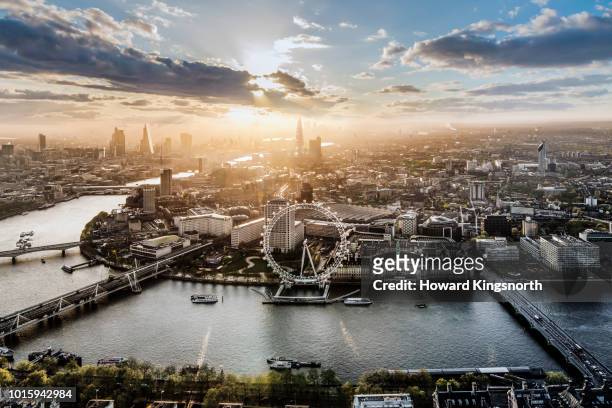 aerial of the london eye at sunrise - london england stock-fotos und bilder