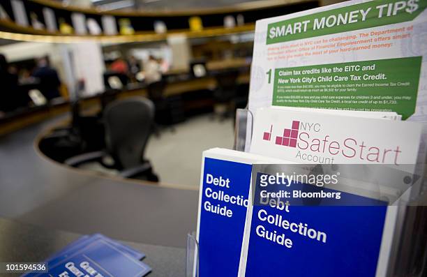 Debt collection guide sits on a counter during the opening of the "Financial Literacy Central" at the New York Public Library's Science, Industry and...