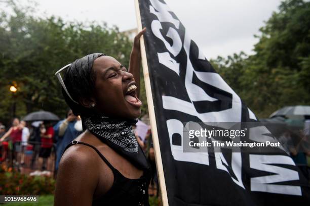 Diamond Simms of Black Lives Matter DC, yells while hundreds of counterprotestors to the Unite the Right 2 rally congregate in Lafayette Square on...