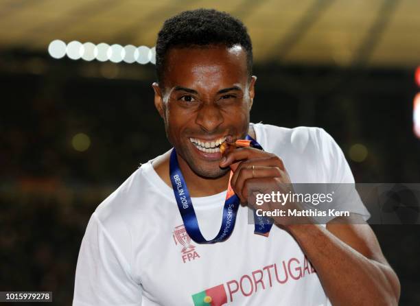 Nelson Evora of Portugal, gold, poses with his medal for the Men's Triple Jump during day six of the 24th European Athletics Championships at...