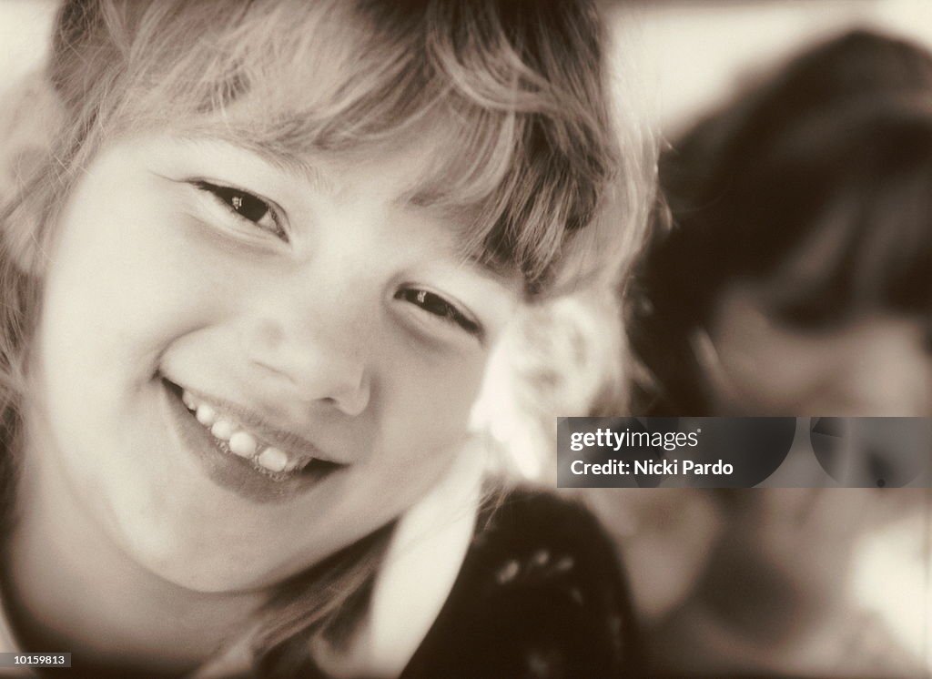 YOUNG SISTERS SMILING, MANSFIELD, MASSACHUSETTS