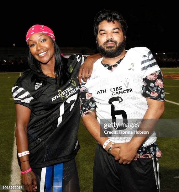 Carmelita Jeter and Adrian Dev participate in the 5th annual Athletes vs Cancer Celebrity Flag Football Game on August 12, 2018 in Los Angeles,...