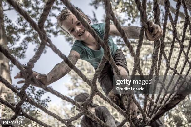 child on mud run obstacle course - military training stock pictures, royalty-free photos & images