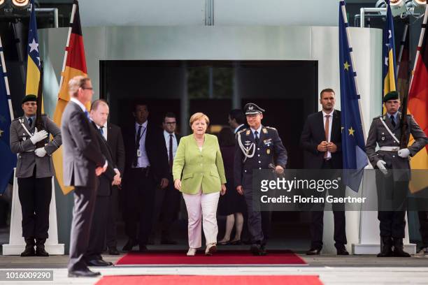 German Chancellor Angela Merkel is pictured before military honours on August 13, 2018 in Berlin, Germany. Chairman of the Council of Ministers of...