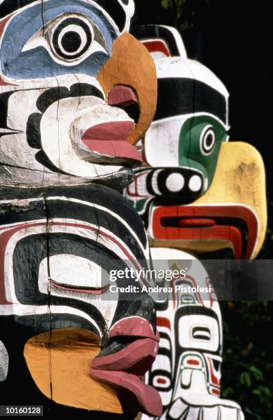 totem poles, stanley park, vancouver - totem pole stock pictures, royalty-free photos & images