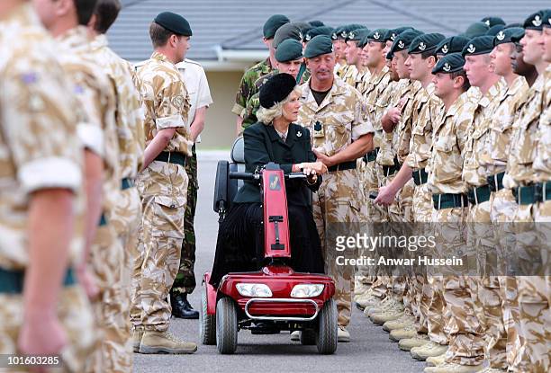 Camilla, Duchess of Cornwall uses a mobility scooter after breaking her leg while walking in Scotland as she presents Afghanistan campaign medals to...