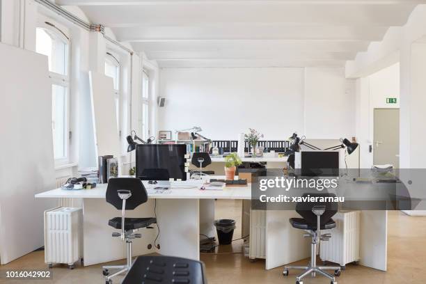 chairs arranged at desk in office - empty office window stock pictures, royalty-free photos & images