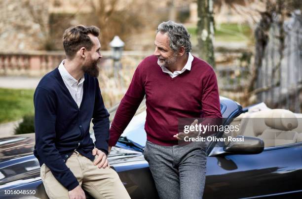 father and adult son talking at convertible car - conversation car bildbanksfoton och bilder