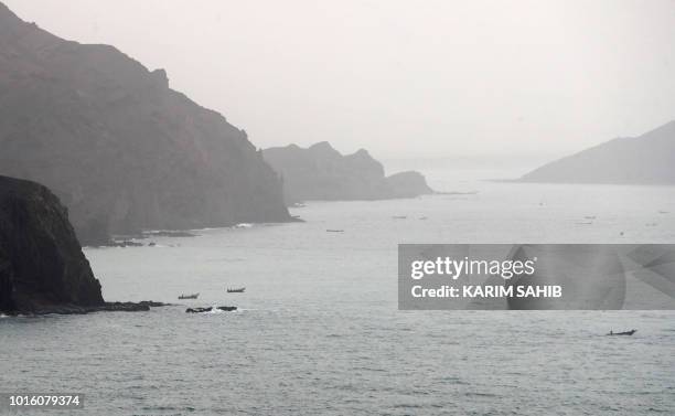 Picture taken on August 10, 2018 during a trip in Yemen organised by the UAE's National Media Council shows a view of Yemeni fishing boats along the...