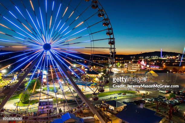 night summer aerial view of the branson ferris wheel in branson, missouri - missouri stock pictures, royalty-free photos & images
