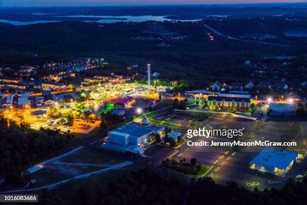 night summer aerial view of hwy 76 strip in branson, missouri - 1011957648,1011945618,1011950492,1011960800,1011954950,1011953954,1015768380,1015768366,1015768370,1015768372,1015768382,1015768398,1015768412,1015768410,1015768414,1015768418,1015768438,1015768448,1015768450,1015768488,1015768474,1015768478,1015768504,1015768508,1016083590,1016083634,1016083592,1016083608,1016083686,1016083708,1016083780,1016083774,1016083796,1016083828,1016083994,1016083992,1016083982,1016083980 stock pictures, royalty-free photos & images