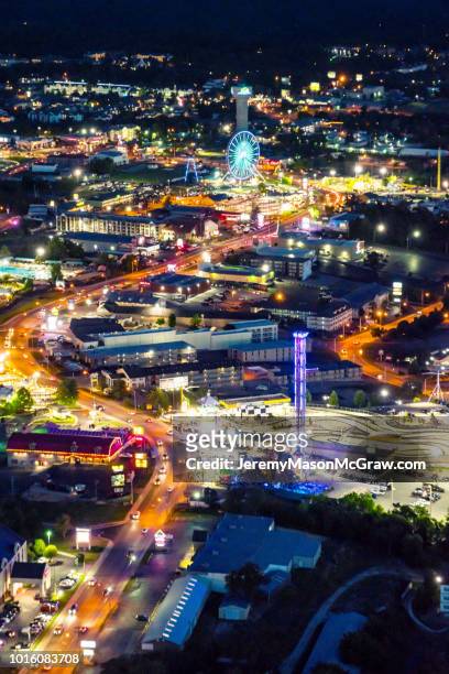 night summer aerial view of hwy 76 strip in branson, missouri - 1011957648,1011945618,1011950492,1011960800,1011954950,1011953954,1015768380,1015768366,1015768370,1015768372,1015768382,1015768398,1015768412,1015768410,1015768414,1015768418,1015768438,1015768448,1015768450,1015768488,1015768474,1015768478,1015768504,1015768508,1016083590,1016083634,1016083592,1016083608,1016083686,1016083708,1016083780,1016083774,1016083796,1016083828,1016083994,1016083992,1016083982,1016083980 stock pictures, royalty-free photos & images