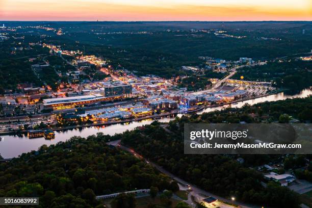 night aerial view of downtown branson, missouri and lake tanycomo - branson missouri stock pictures, royalty-free photos & images