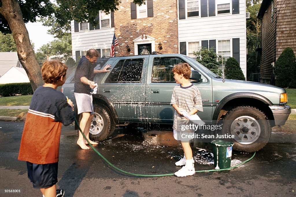 DAD AND SONS WASHING THE CAR