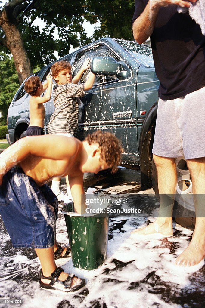 DAD AND SONS WASHING THE CAR