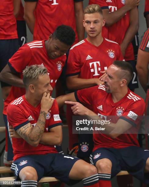 Rafinha, David Alaba, Franck Ribery and Joshua Kimmich of FC Bayern Muenchen joke during the team presentation at on August 13, 2018 in Munich,...