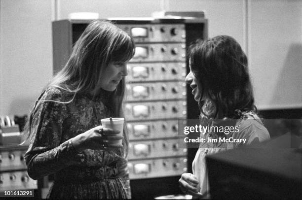 Joni Mitchell talks to Carole King in the control room of A&M Records Recording Studio during the recording of King's album 'Tapestry' in January...