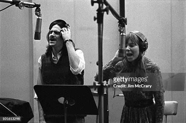 Singer-songwriters James Taylor and Joni Mitchell provide backing vocals during the recording of Carole King's album 'Tapestry' at A&M Records...