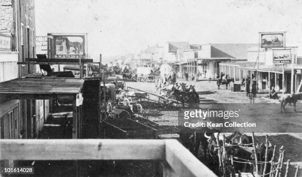 Wagons arriving in a new town in the American west, circa 1870.