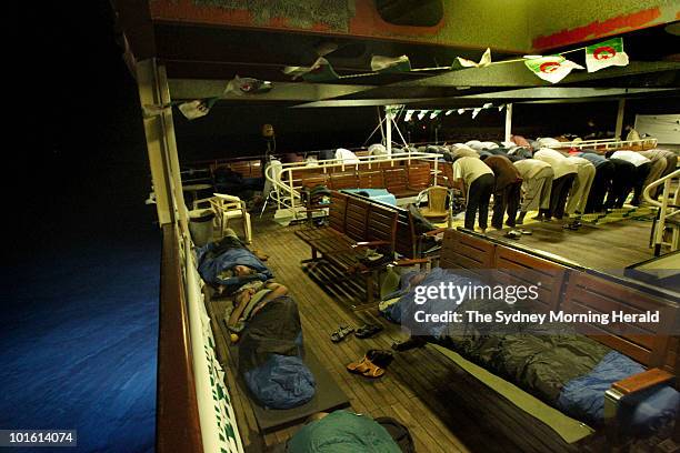 Activists sleep and pray on the Turkish passenger ship Mavi Marmara , part of the Freedom Flotilla carrying 600 activists bound for Gaza, on May 29,...
