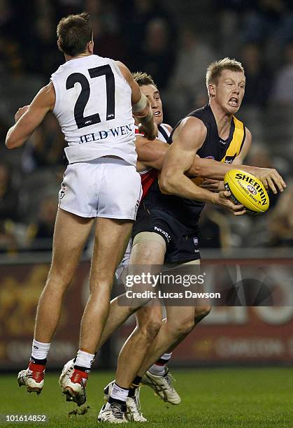 Jack Riewoldt of the Tigers marks the ball during the round 11 AFL match between the Richmond Tigers and the St Kilda Saints at Etihad Stadium on...