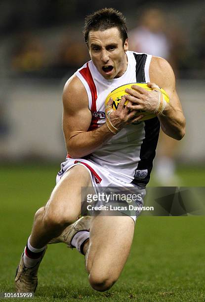 Stephen Milne of the Saints marks the ball during the round 11 AFL match between the Richmond Tigers and the St Kilda Saints at Etihad Stadium on...