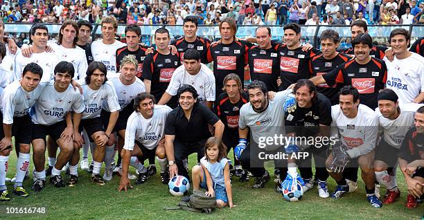 Argentine former football legend and national team head coach Diego Maradona and Uruguay's former footballer Enzo Francescoli pose for a picture with...