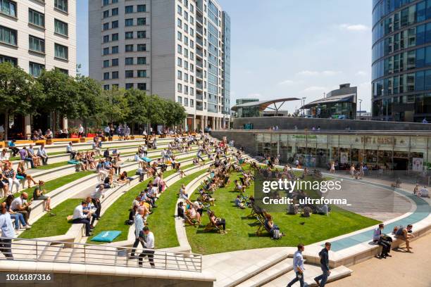 lunch time at sheldon square amphitheatre and office architecture in paddington, london - amphitheater stock pictures, royalty-free photos & images