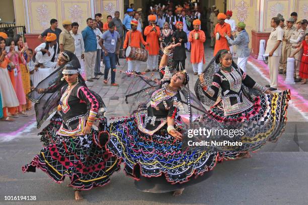 Rajasthani folk artists perform as they take part in a traditional 'Teej Procession ' in Jaipur , Rajasthan, India ,13 August,2018. Indian married...