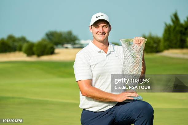 Sepp Straka of Austria earns his first career win holding the 2018 KC Golf Classic trophy at the Nicklaus Golf Club at LionsGate on August 5, 2018 in...