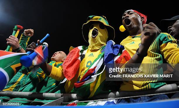 Supporters of South Africa sing and play the vuvuzela, large coloured plastic trompet, before the Fifa Confederations Cup football match South Africa...