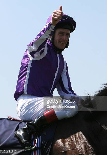 Johnny Murtagh riding Fame and Glory celebrate winning The Investec Coronation Cup during Ladies Day at Epsom Racecourse on June 04, 2010 in Epsom,...