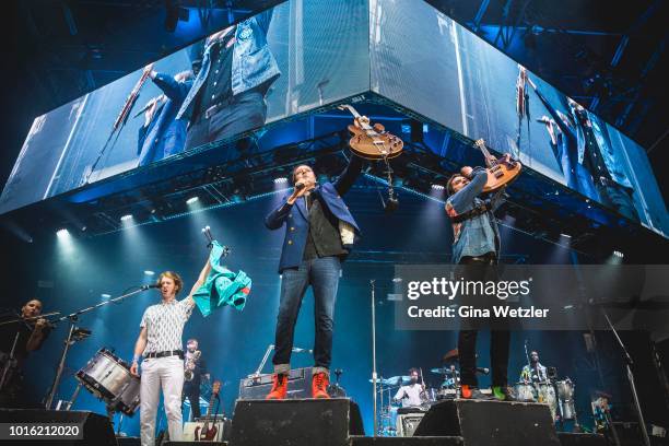 Members of the Canadian band Arcade Fire performs live on stage during a concert at the Zitadelle Spandau on August 13, 2018 in Berlin, Germany.