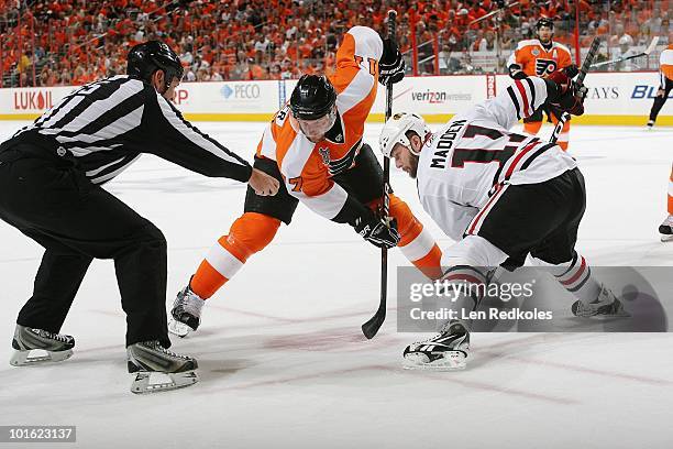 Jeff Carter of the Philadelphia Flyers and John Madden of the Chicago Blackhawks ready for a face-off in Game Three of the 2010 NHL Stanley Cup Final...