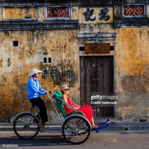 vietnamese cycle rickshaw in old town in hoi an city, vietnam - rickshaw or tuk tuk or surrey or pedicab stock pictures, royalty-free photos & images