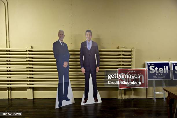 Cutouts of U.S. Vice President Mike Pence and U.S. House Speaker Paul Ryan, a Republican from Wisconsin, stands in a County Republican office in...