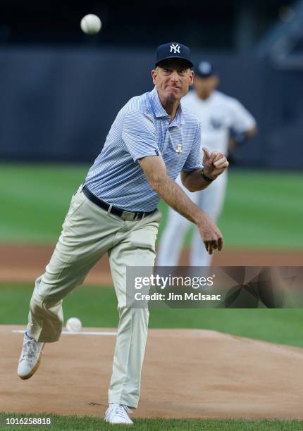 United States Ryder Cup Captain Jim Furyk throws the ceremonial first pitch of a game between the New York Yankees and the New York Mets at Yankee...