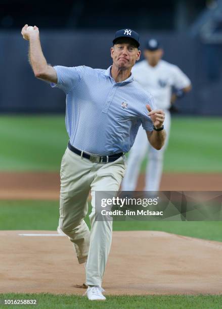 United States Ryder Cup Captain Jim Furyk throws the ceremonial first pitch of a game between the New York Yankees and the New York Mets at Yankee...