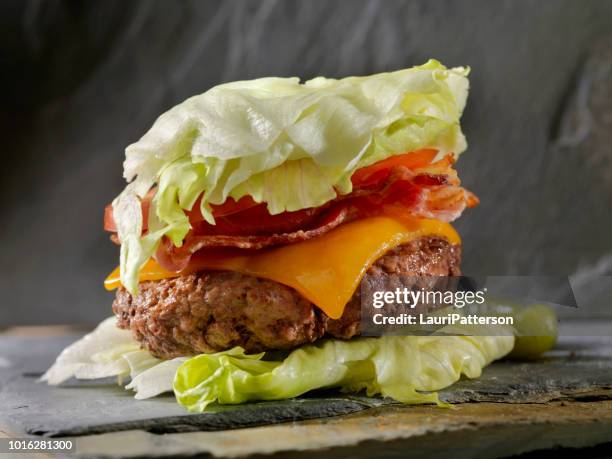 low carb - lettuce wrap bacon cheeseburger - low carb diet stock pictures, royalty-free photos & images