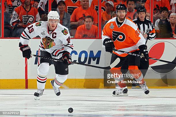 Jonathan Toews of the Chicago Blackhawks fights for the puck against Ville Leino of the Philadelphia Flyers in Game Four of the 2010 NHL Stanley Cup...
